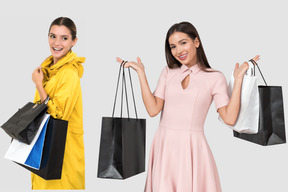 Young women holding shopping bags
