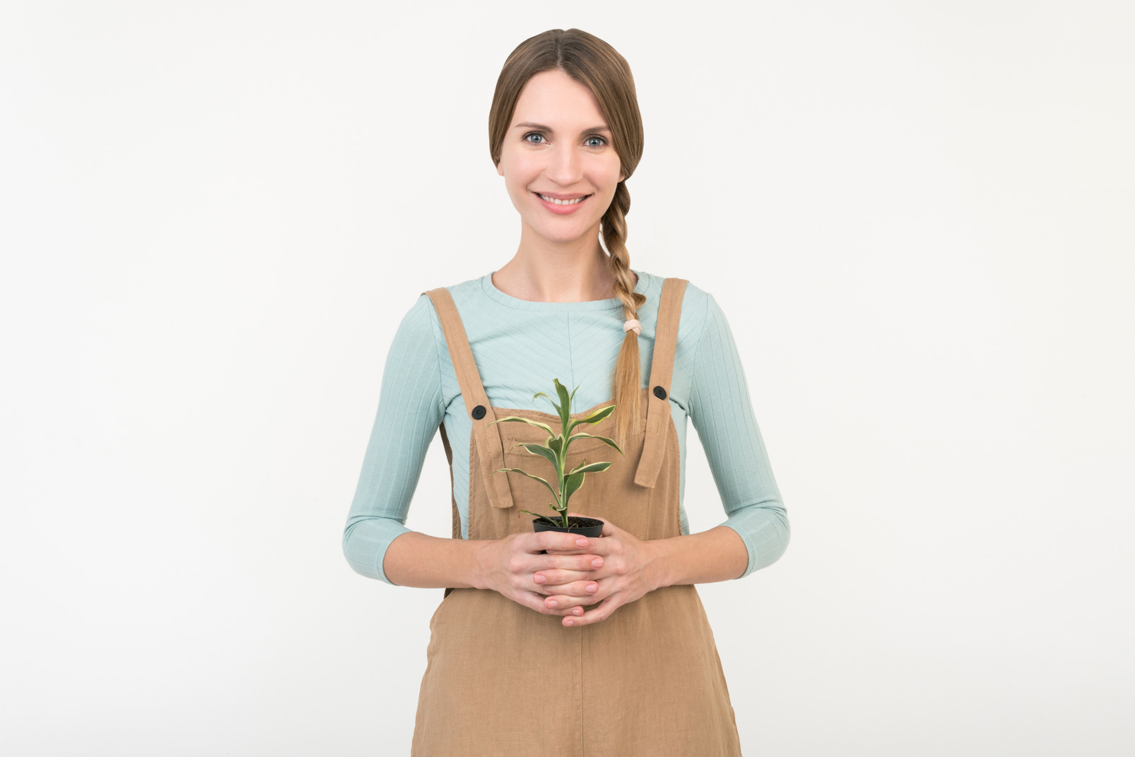 Young female farmer holding plant