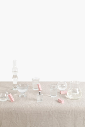 Glass containers of different shapes filled with water