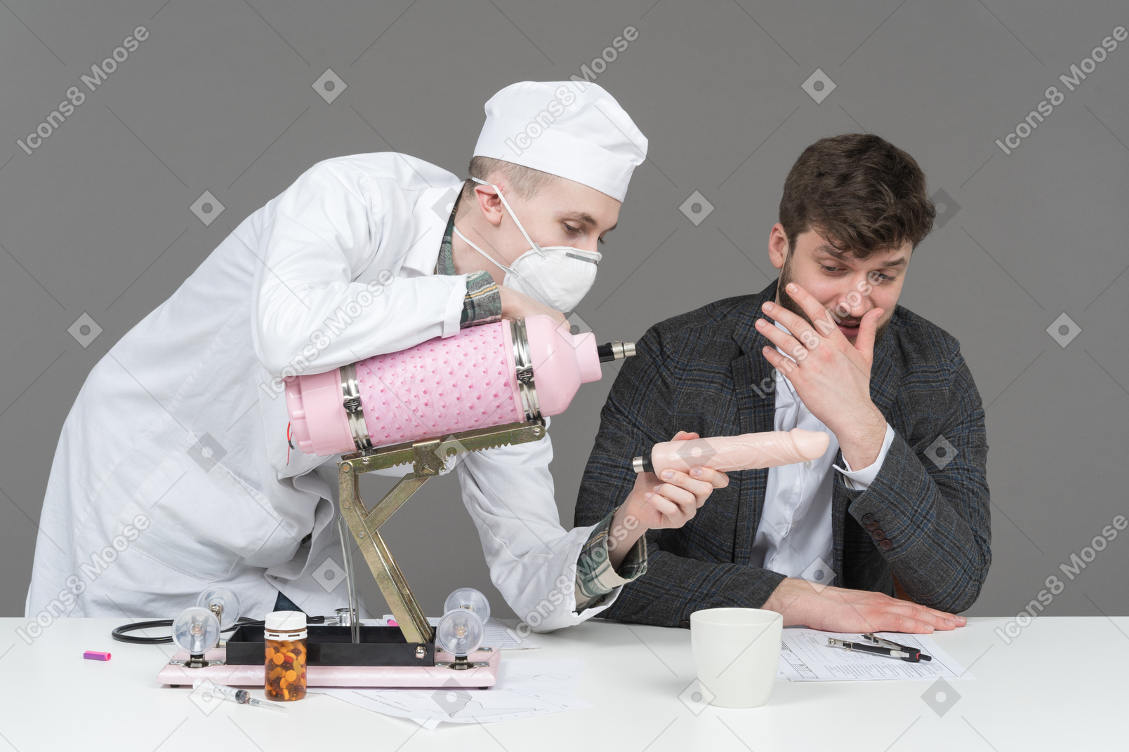 Doctor and young man installing sex machine