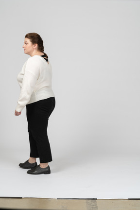 Side view of plump woman in casual clothes