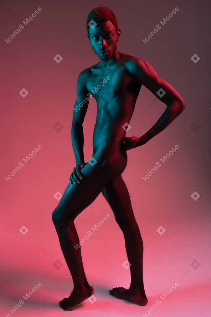 Naked young black man looking at camera
