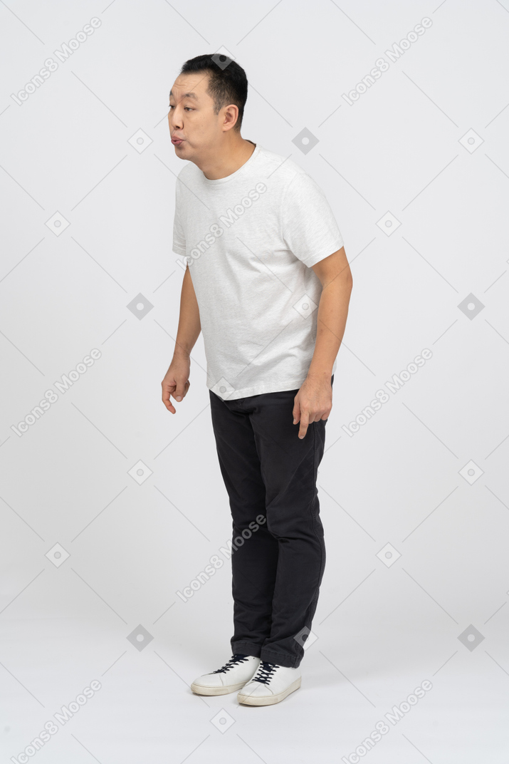 Man in casual clothes staring at something