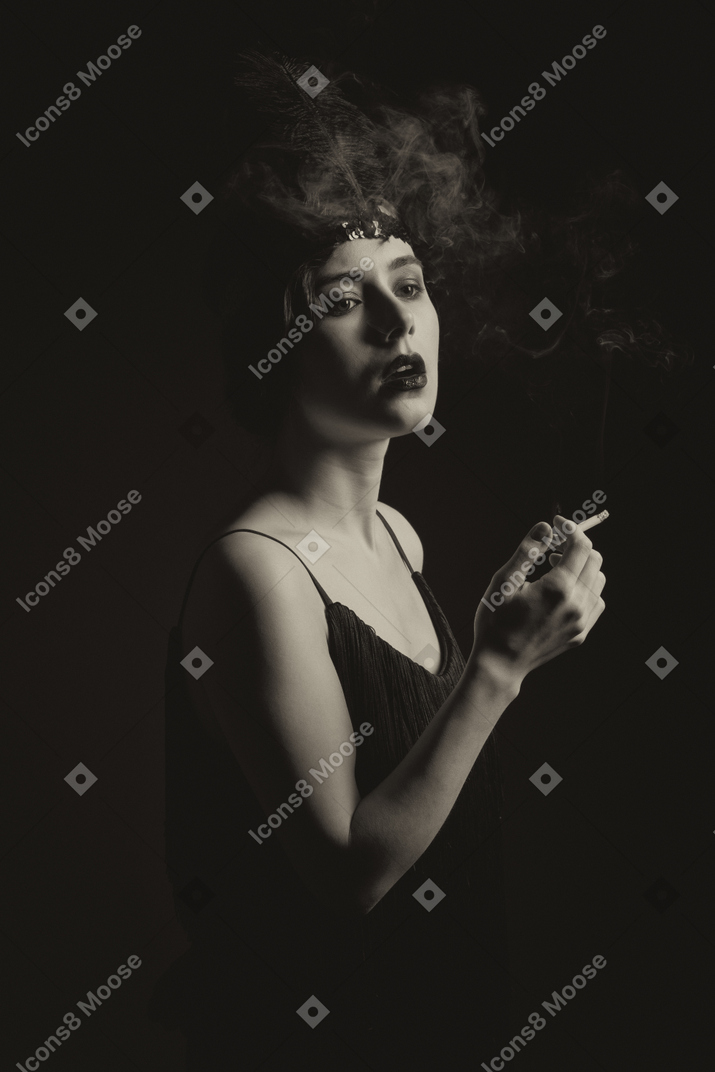 Silhouette of a flapper holding a cigarette