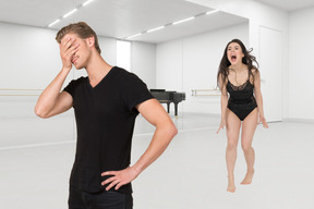 A man and a woman in a dance studio