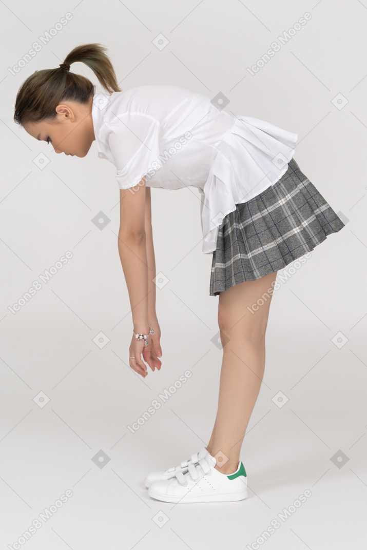 Sporty girl bending over