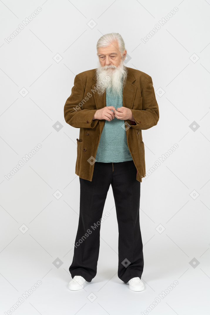Portrait of an old man fidgeting, looking pensive
