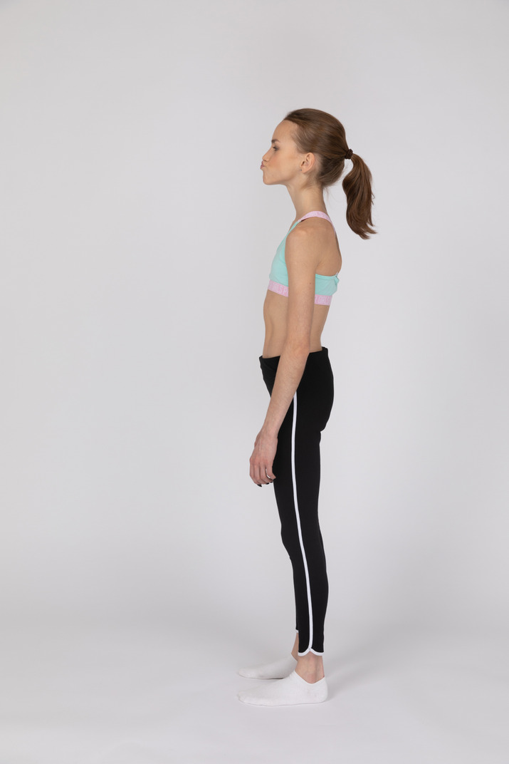 Side View Of A Teen Girl In Sportswear Raising Hand And Arguing Photo
