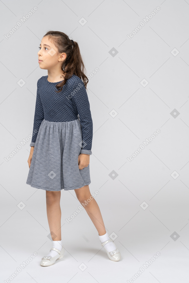 Front view of a girl stepping to the side curiously