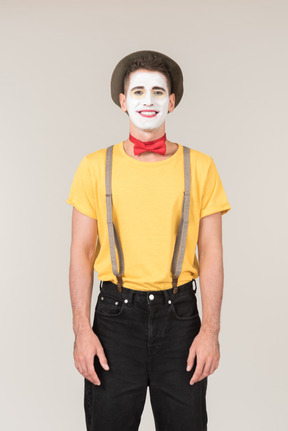 Smiling male clown looking right into the camera