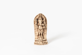 Ganesh the elephant god statue on white background