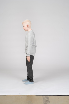 Side view of a boy standing