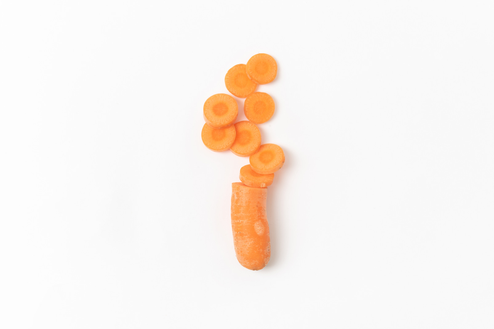 Cut carrot on white background