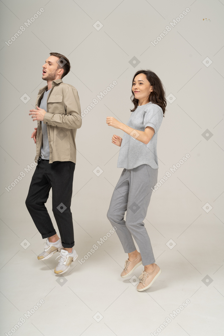 Happy man and woman running