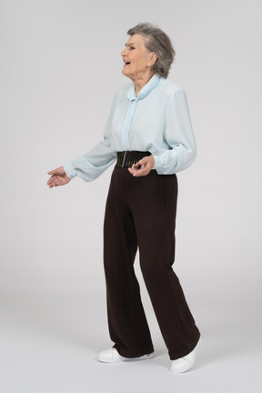 Three-quarter view of an old woman in motion