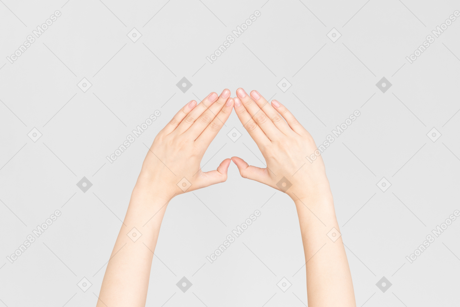 Female hands making an upside down heart