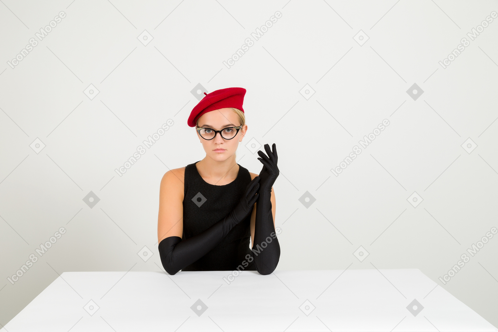 Elegant young woman in red beret and glasses