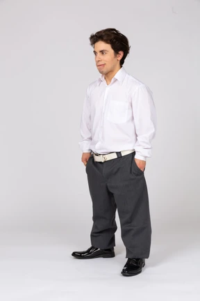 Young man standing and grinning