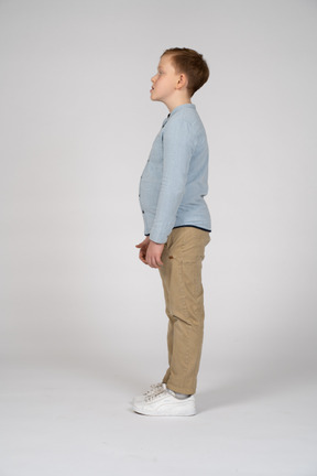 Boy standing in profile