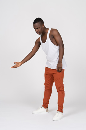 Young man leaning forward and offering handshake