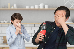 A man and a boy are in the kitchen