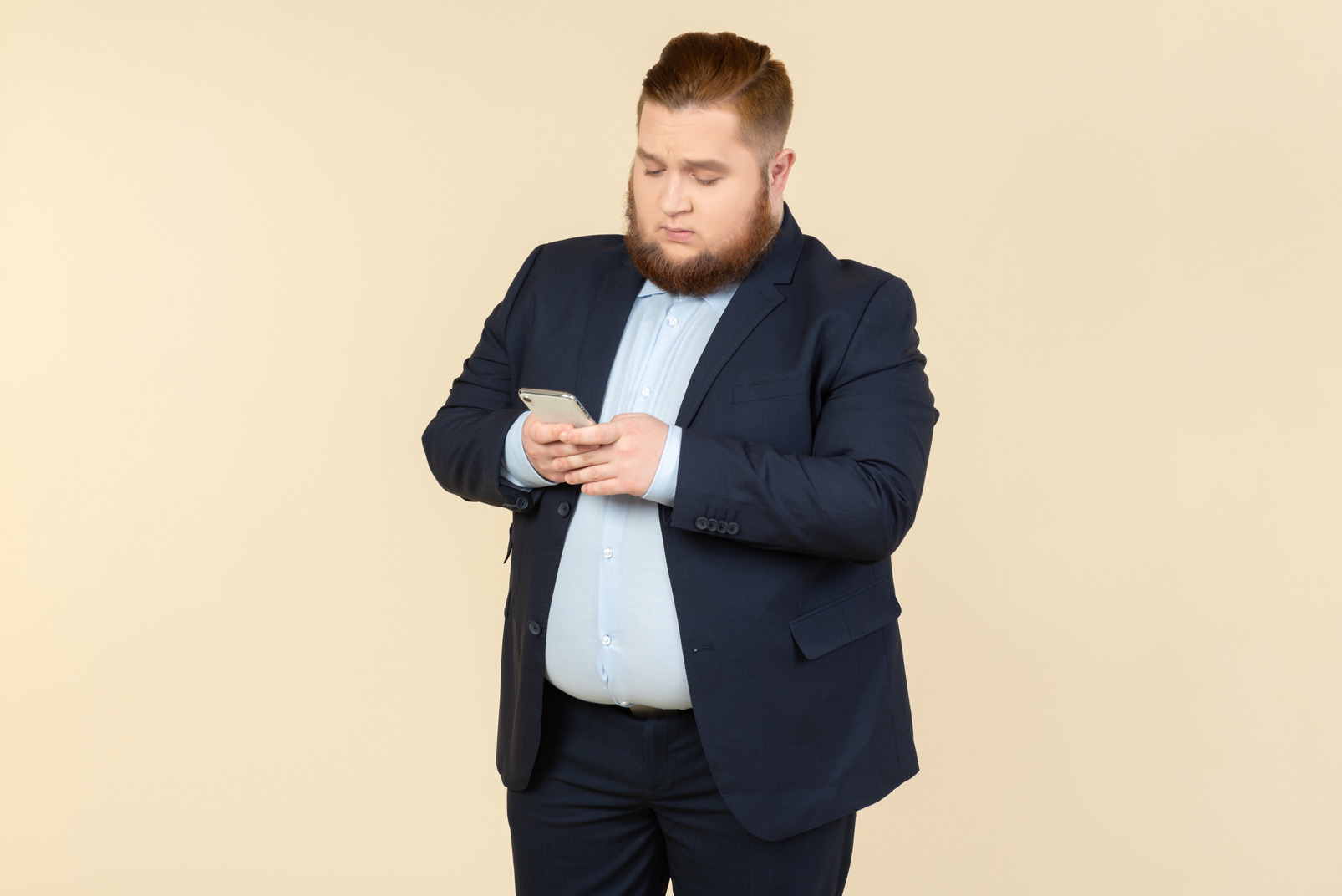 Young overweight office worker checking phone