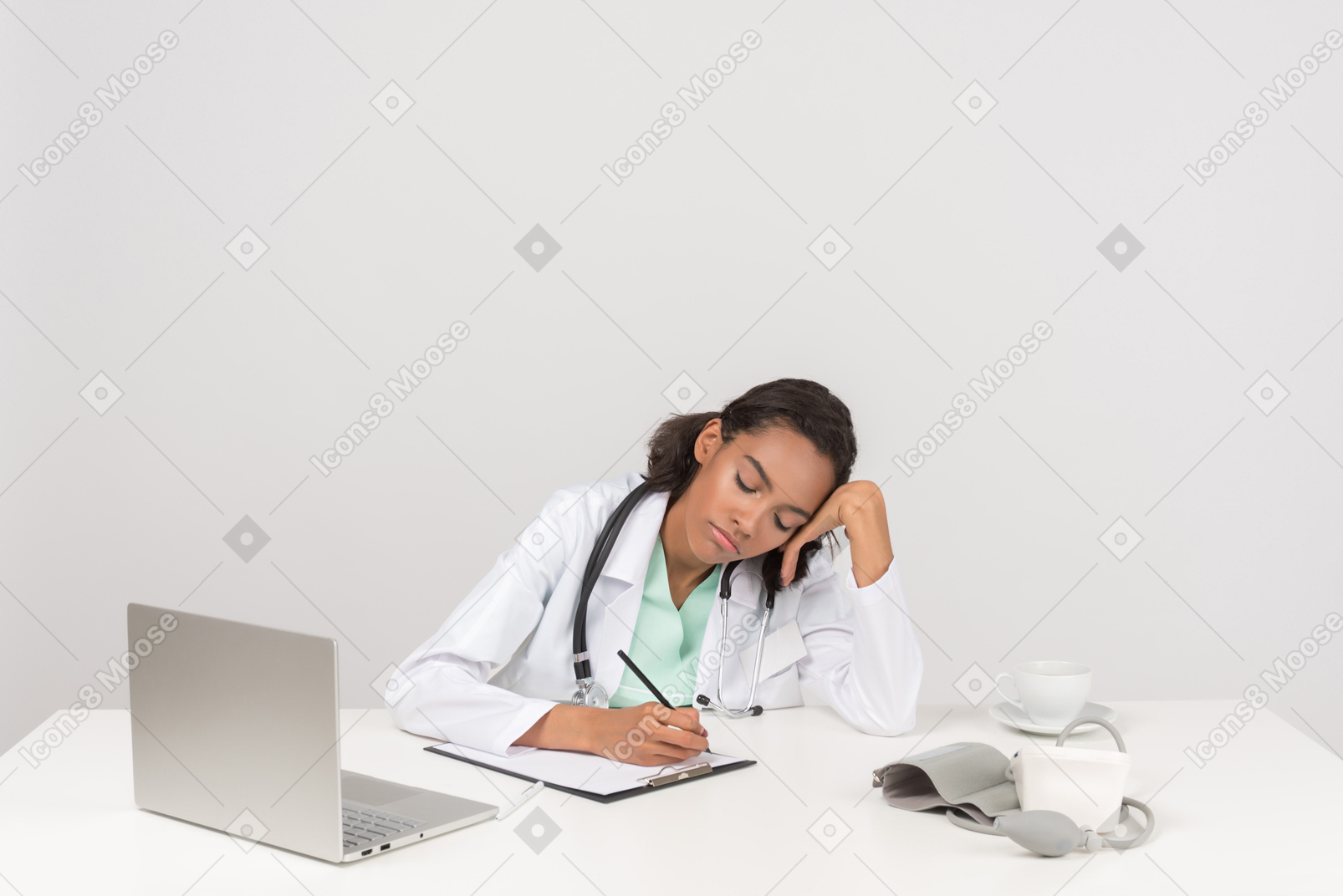 Female doctor tired and almost sleeping