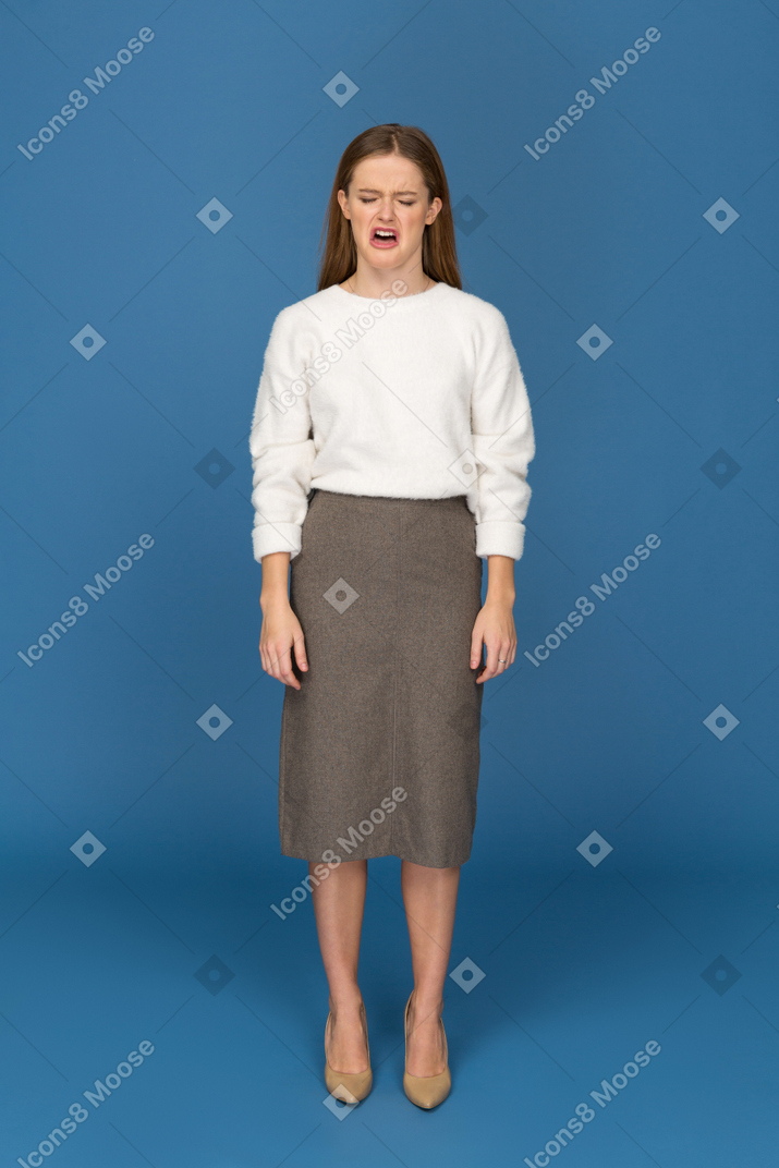 Young businesswoman yawning