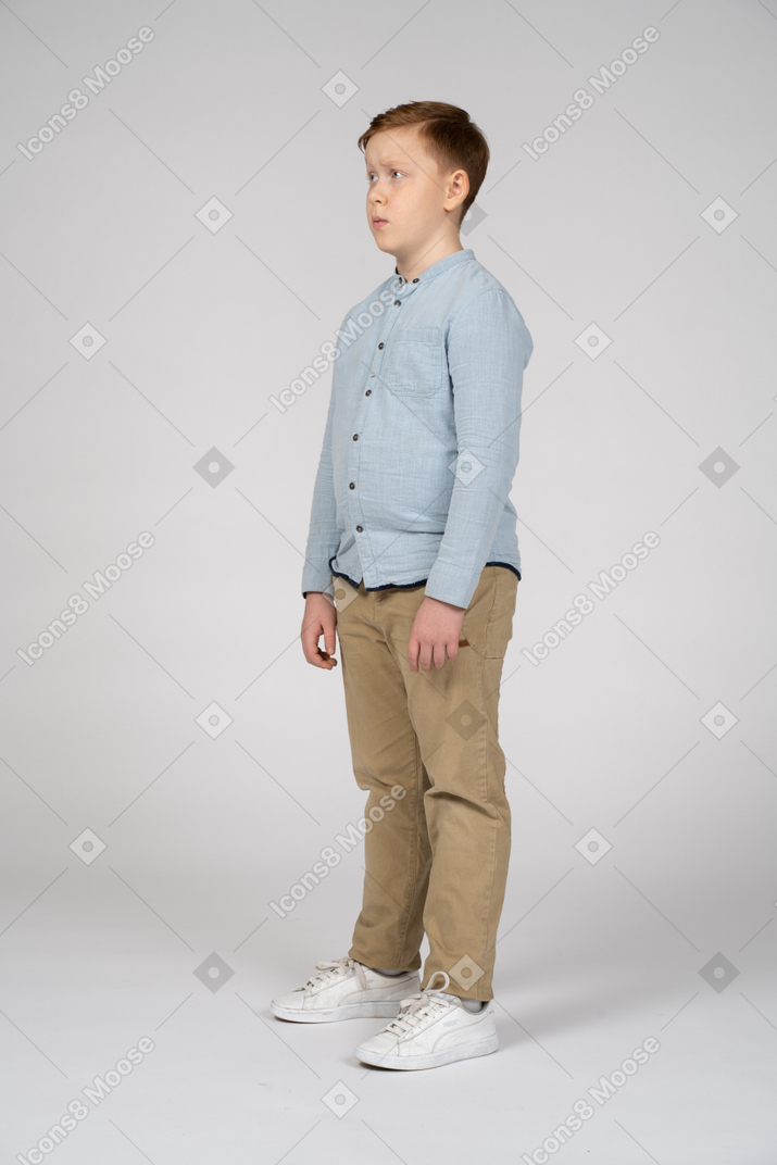 Boy in casual clothes making faces