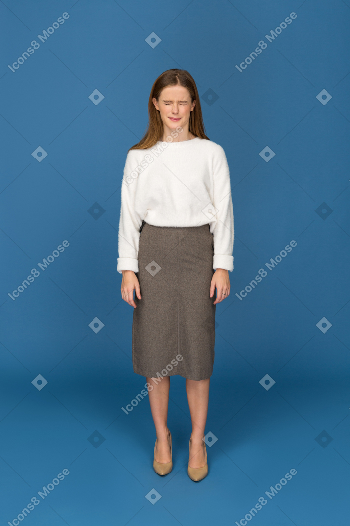 Young businesswoman cringing
