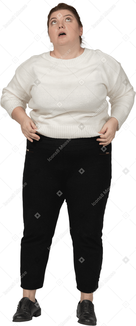 Front view of a plump woman in casual clothes looking up