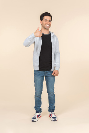 Smiling caucasian man showing thumbs up