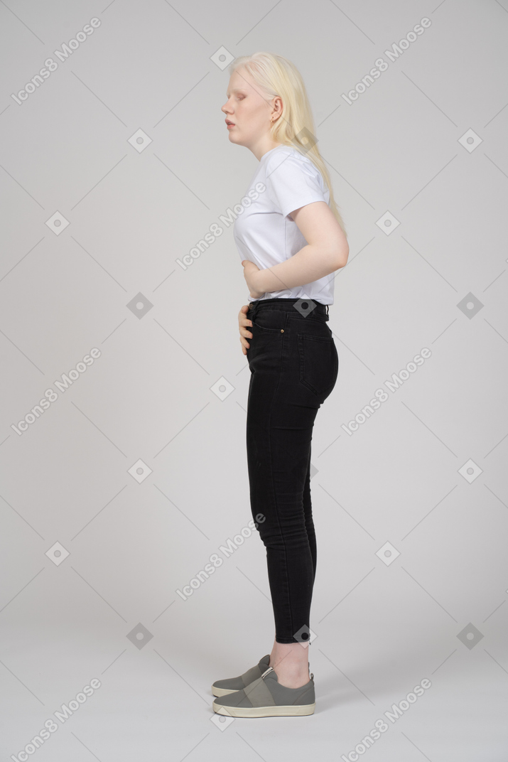 Side view of a woman having a stomach ache