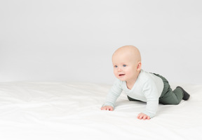 Baby boy lying on stomach