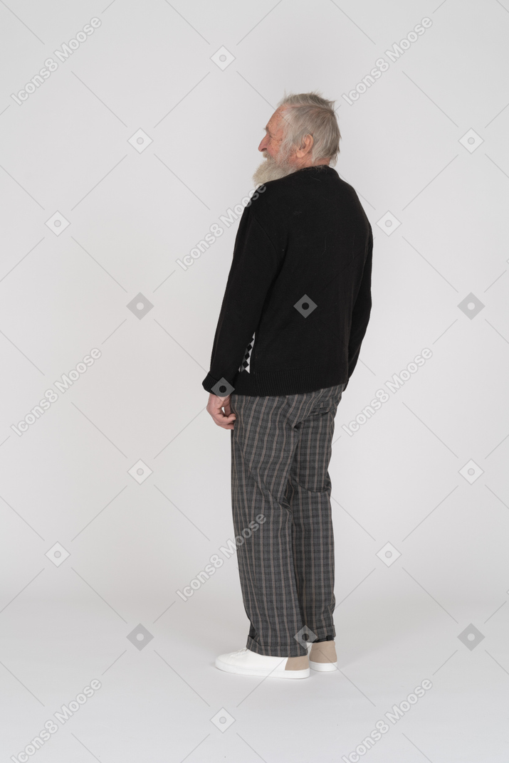 Back view of an old man standing and laughing