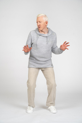 Front view of a man with bent arms and knees