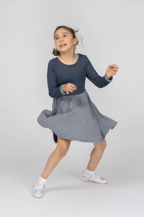 Three-quarter view of a girl dancing in motion
