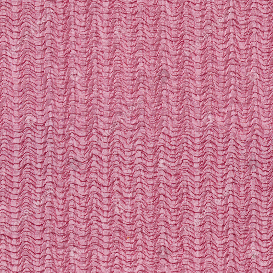 ピンクの波状の生地の質感