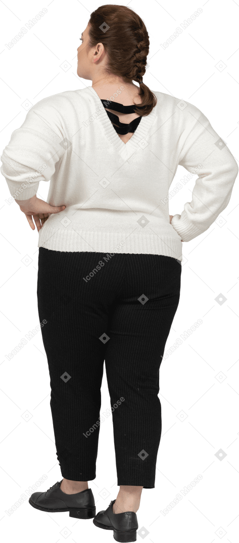 Confident plump woman in casual clothes standing