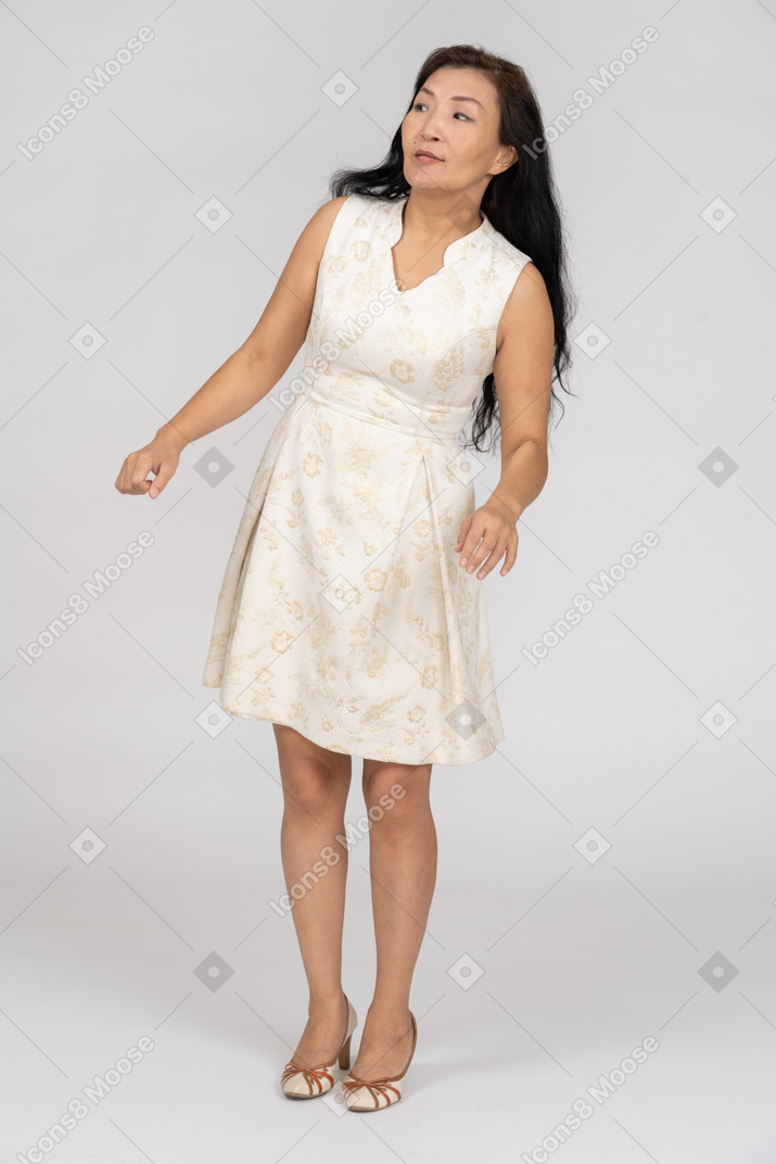 Woman in a white dress standing