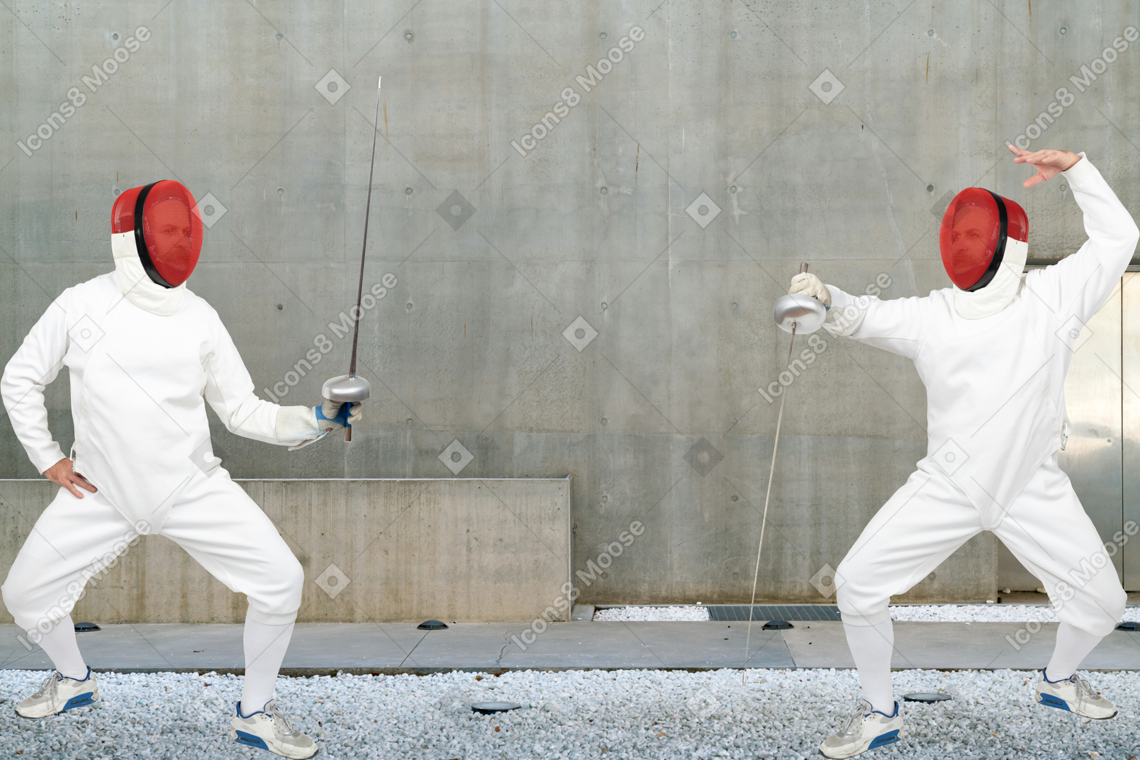 Men wearing fencing suits practicing with swords