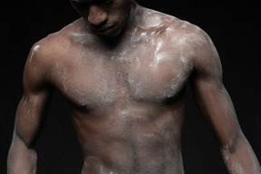 Close-up male torso all in flour