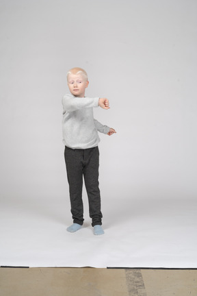 Boy in casual clothes spinning around