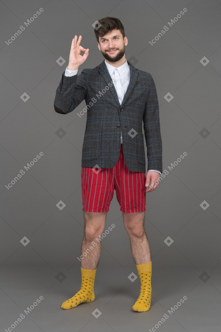 Cheerful man making ok gesture with his fingers