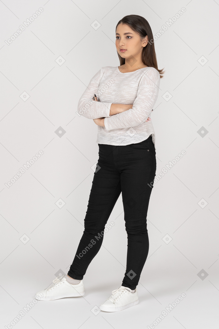 Annoyed girl standing with her arms crossed