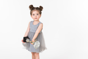 Little girl holding an award cup