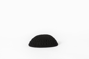 Black kippah on white background