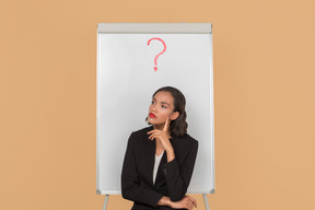 Attractive afro woman sitting by the whiteboard