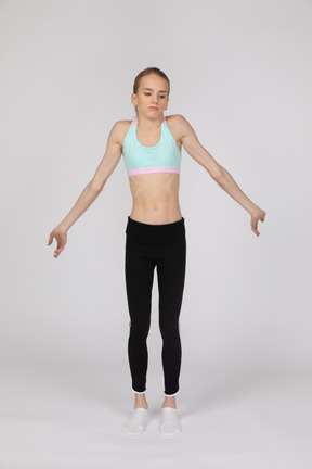 Confused girl standing with her arms spread
