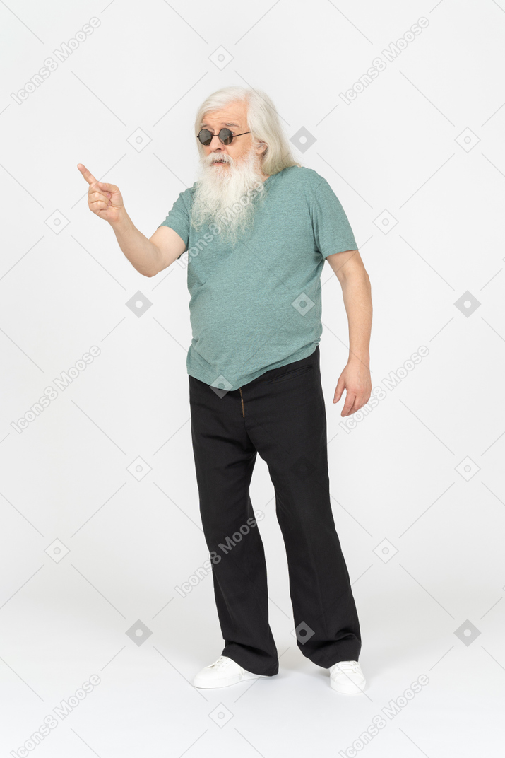 Three-quarter view of old man pointing